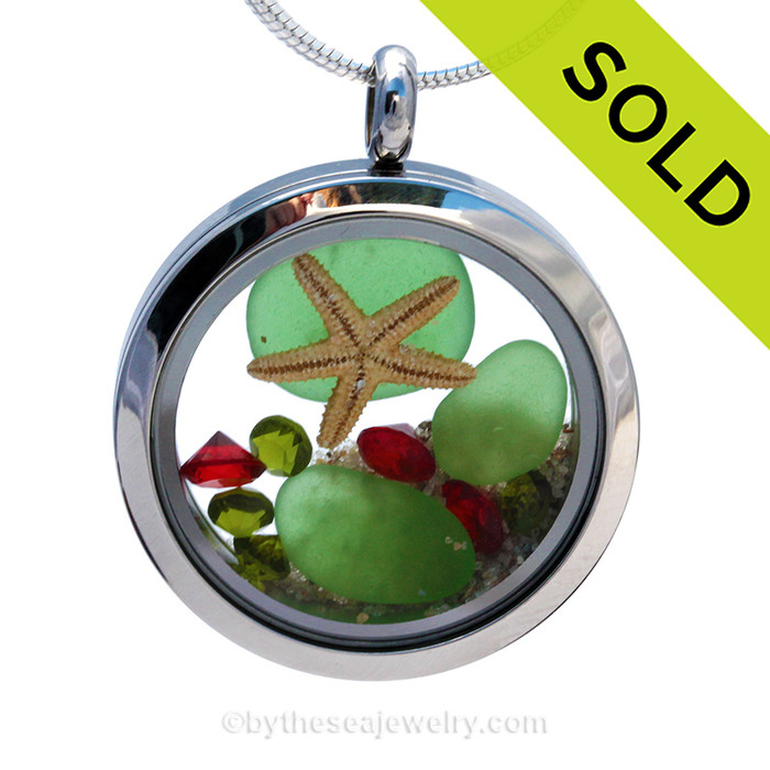 Green sea glass and vivid ruby red and peridot green gemstones make this a great locket necklace for the holidays.