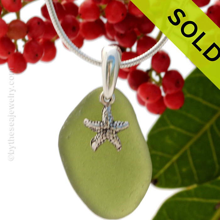 Stunning Bright Jungle Green sea glass set on a solid sterling cast bail with a sterling silver Starfish charm.
