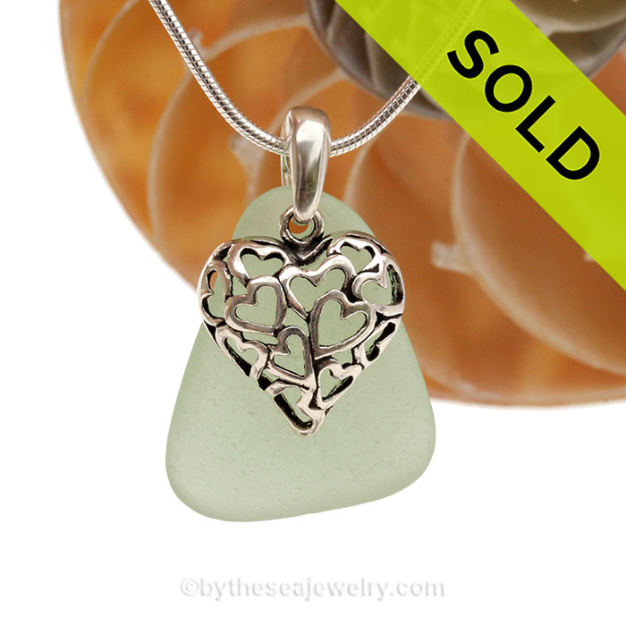 A  perfect piece of larger seafoam green  genuine sea glass with a solid sterling bail and detailed heart in hearts charm.
SOLD - Sorry this Sea Glass Necklace is NO LONGER AVAILABLE!