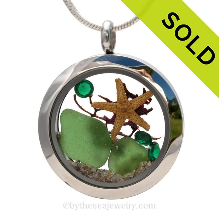 Vivid Green Genuine Sea Glass in this Stainless Steel Locket Necklace is combined with vivid Emerald Green Crystals and a bit of vintage Seafan and baby Starfish.
SOLD - Sorry this Sea Glass Locket is NO LONGER AVAILABLE!