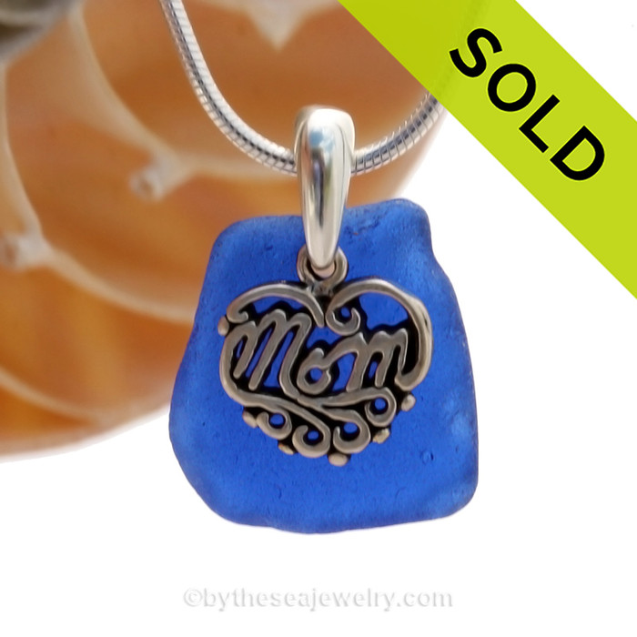 A nice piece of Good Quality Certified Genuine Sea Glass from North Carolina set with a detailed solid sterling Heart charm that lets MOM know you love her. 