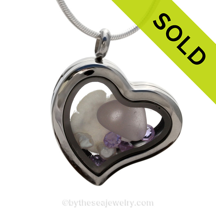 Lavender sea glass with seafan and fresh water pearls and lavender crystal gems.