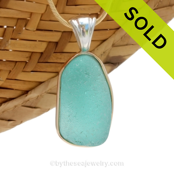 This is a beautiful Vivid Bright Aqua Blue Sea Glass set in our Mixed Deluxe Tiffany Wire Bezel© pendant setting .
SOLD - Sorry this Rare Sea Glass Pendant is NO LONGER AVAILABLE!