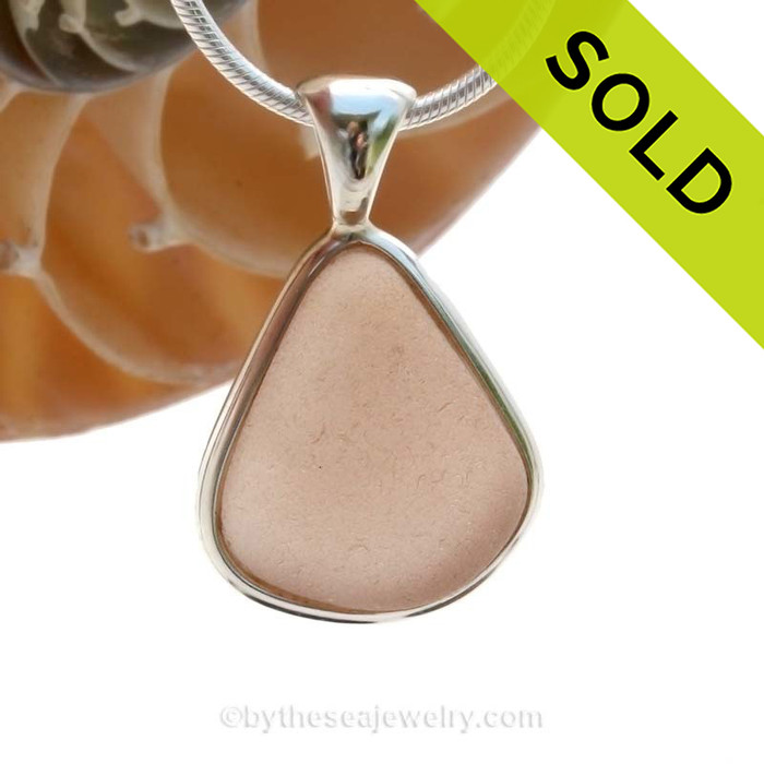 This perfect triangle of peach sea glass is set in a mixed metal gold and sterling silver Deluxe Wire Bezel setting. Very Versatile and elegant. CLASSIC!
SOLD - Sorry this Rare Sea Glass Pendant is NO LONGER AVAILABLE!