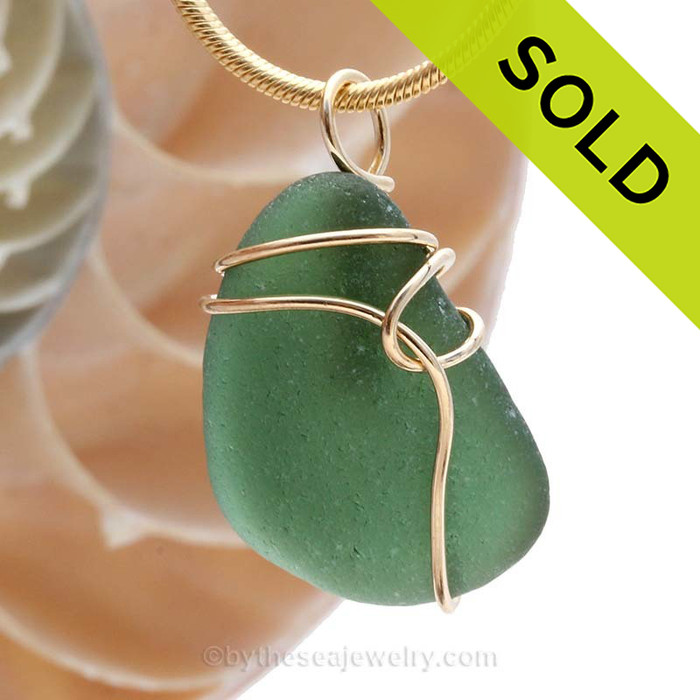 SOLD - Sorry this Sea Glass Pendant is NO LONGER AVAILABLE!
A Beautiful Jungle Green Genuine Sea Glass piece set in our simple and secure Deco Inspired  14K rolled gold setting.