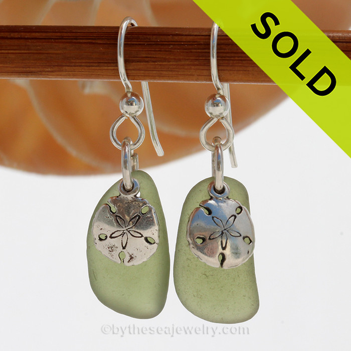 A simple pair of green Genuine Sea Glass Earrings with sterling beachy Sandollarp charms in a lightweight simple setting.
SOLD - Sorry these Sea Glass Earrings are NO LONGER AVAILABLE!