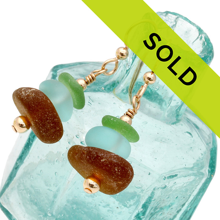Green and brown sea glass pieces combined with aqua glass beads in a 14K Goldfilled earring.
Sorry this sea glass jewelry item has been sold!