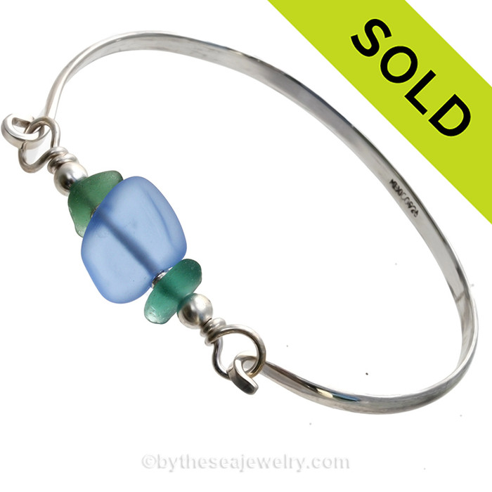 Two nice pieces of aqua green Hawaiian Sea Glass with Vivid Blue lampwork Glass Beads on this Solid Sterling Silver half round Sea Glass Bracelet.
SOLD - Sorry this Sea Glass Bangle Bracelet is NO LONGER AVAILABLE!