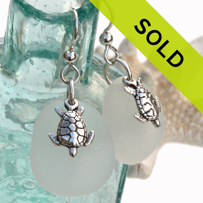 Larger perfect pieces of pure white sea glass are set with solid sterling sea turtles on french earwires.
A nice larger pair of earrings!

Sorry this pair of sea glass earrings has SOLD!
