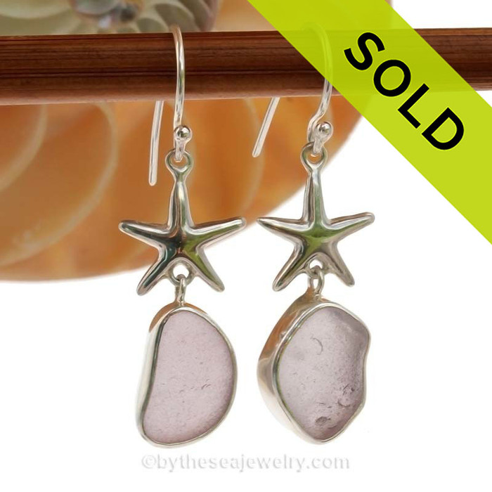 A stunning pair of medium Lavender or Purple sea glass earrings set in a finely crafted setting in sterling silver.
Once in a lifetime pair!