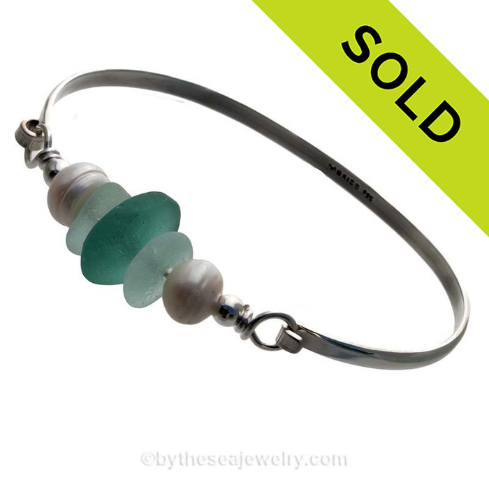 Seafoam Green Sea Glass pieces and a large Aqua recycled glass bead on this Solid Sterling Silver Half Round Bangle Bracelet with LARGE real Cultured Freshwater Pearls.
SOLD - Sorry this Sea Glass Bangle Bracelet is NO LONGER AVAILABLE!