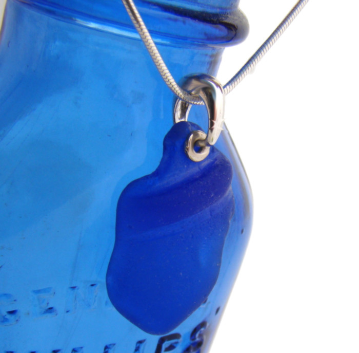 A LARGE piece of ridged large cobalt blue sea glass on solid sterling silver bail.

Shown here with an 18 inch sterling snake chain (NOT INCLUDED - but recommended and available as an upgrade below).

This is the EXACT sea glass pendant you will receive