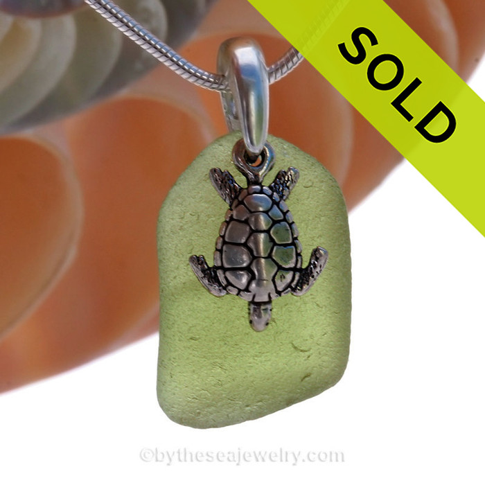 Vivid Peridot Sea Glass Necklace with Beach found green sea glass and solid sterling silver sea turtle charm and Solid Sterling Silver Snake chain.
SOLD - Sorry this Sea Glass Necklace is NO LONGER AVAILABLE!