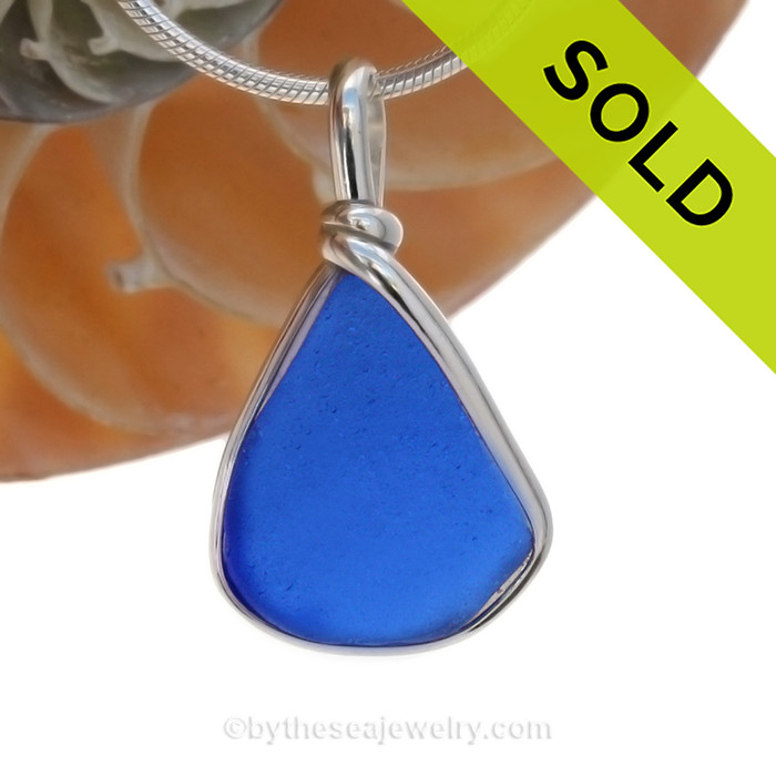 A smaller piece of Cobalt Blue Genuine Sea Glass  bottle bottom with in our signature Original Wire Bezel© pendant setting in Sterling Silver.
SOLD - Sorry this Rare Sea Glass Pendant is NO LONGER AVAILABLE!