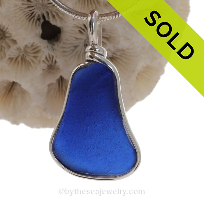 A VIVID Cobalt Blue Thick and Squarish genuine Sea Glass pieces set in our Original Deluxe Wire Bezel© necklace pendant.