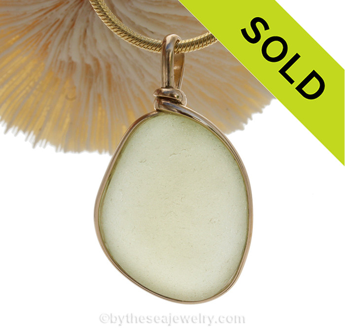 A lovely thick naturally aged pure Pale Butter Yellow natural sea glass piece set in our Original Wire Bezel setting in 14K Rolled Gold setting.
