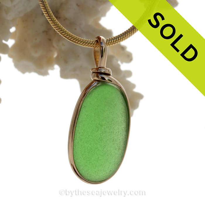 A lovely piece of perfect green Genuine Sea Glass set in our Original Wire Bezel© setting in 14K Rolled Gold