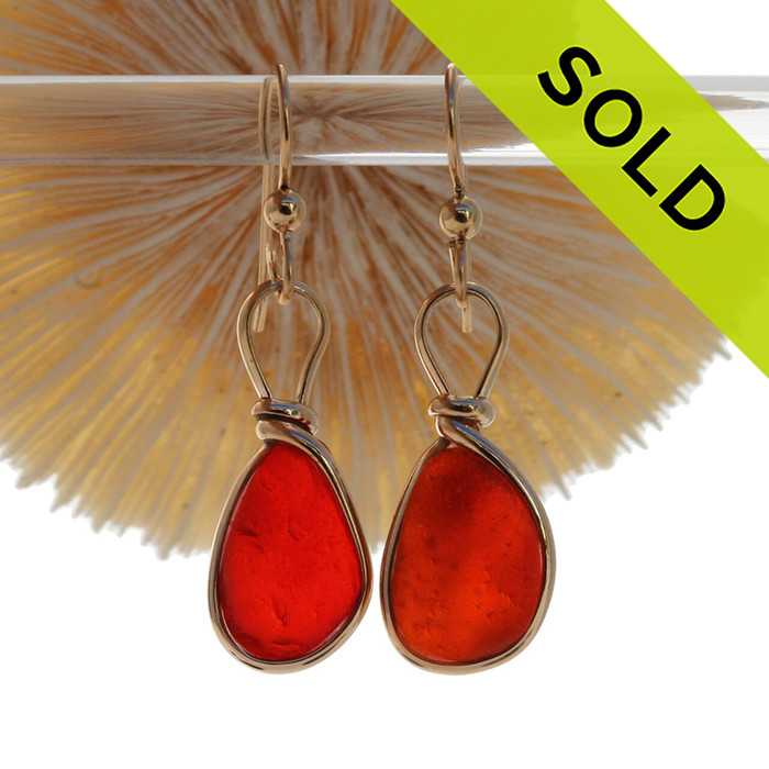 P-E-R-F-E-C-T Certified Vivid Red Orange Genuine Sea Glass in our Original Wire Bezel© earring setting lets all the color of these beautiful gold set beach found sea glass pieces shine!
A beautiful match of Super Ultra Rare sea glass pieces from England.
Red is the hope diamond of sea glasses and this perfect pair is a treasure for any sea glass lover and orange is the find of a lifetime!