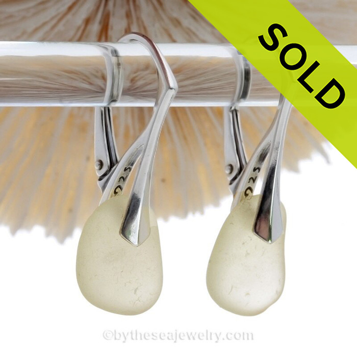 Beautiful light yellow depression era sea glass on solid sterling silver deco leverback earwires.