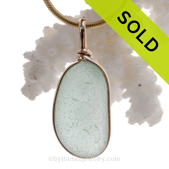 This is a beautiful Seaham Sea Green Sea Glass set in our Original Wire Bezel© pendant setting with 14K rolled gold.