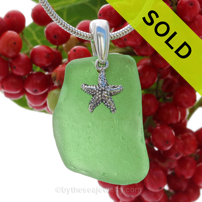 A nice piece of Green Natural Sea Glass Necklace Set On Silver Bail/.