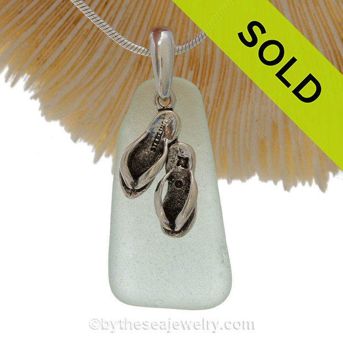 Perfect Pale Aqua Green sea glass necklace set on a solid sterling cast bail with a sterling silver Flip Flop charm.