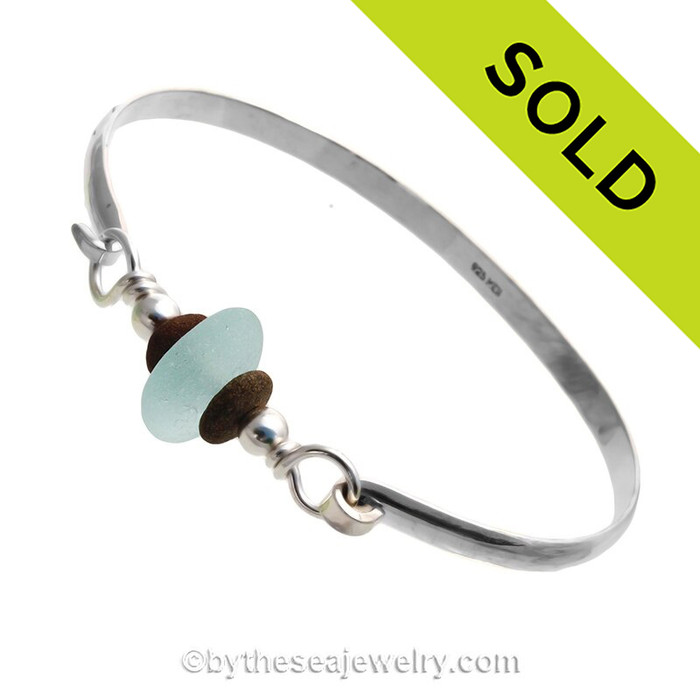 Soft Aqua Blue Genuine English Sea Glass & Natural Beach Stones on this Solid Sterling Silver Half Round Sea Glass Bangle Bracelet. This is finished in solid sterling beads.
SOLD - Sorry this Sea Glass Jewelry selection is NO LONGER AVAILABLE!