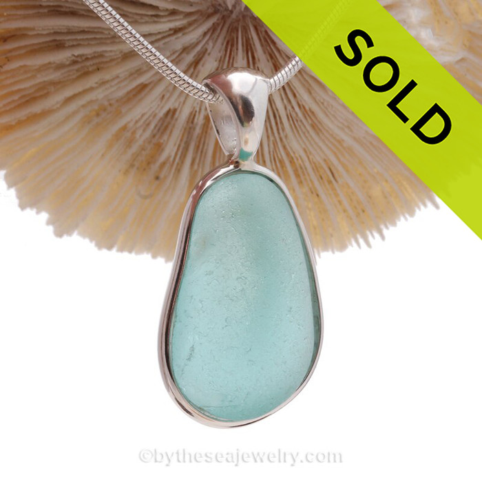 An Aqua Blue Genuine Sea Glass set in our Deluxe  Wire Bezel© pendant setting 