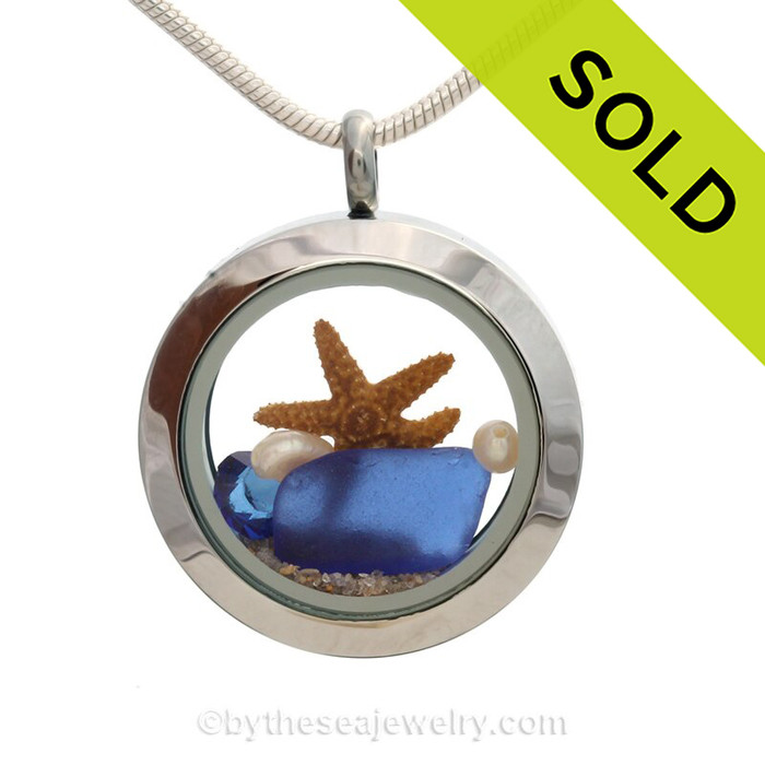 A BEAUTIFUL Natural Cobalt Blue a Sapphire Crystal Gem in this Sea Glass Mini Locket Necklace with a real starfish and real freshwater Pearls.
SOLD - Sorry this Sea Glass Jewelry selection is NO LONGER AVAILABLE!