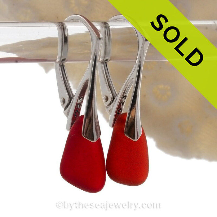 These vivid Ruby Red Natural Sea Glass pieces really glow hanging from these solid sterling silver leverback earrings.