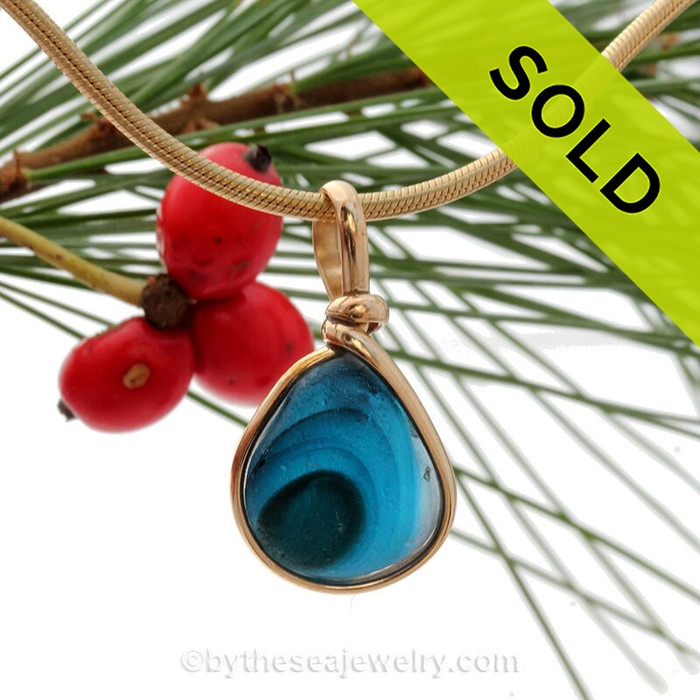 A stunning mixture of tropical aqua and blue in this one of a kind English art sea glass piece. It is set in 14K Rolled Gold in our Original Wire Bezel© setting. Guaranteed for a lifetime of enjoyment!