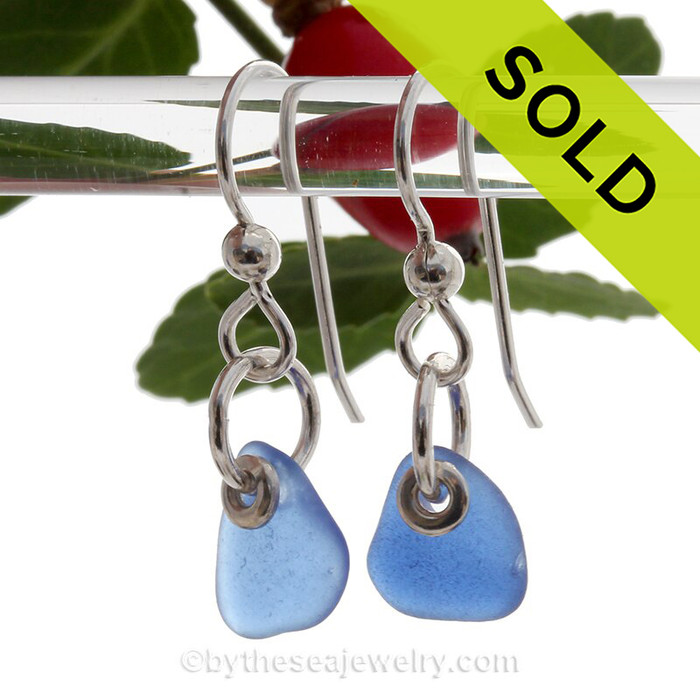 A pair of natural surf tumble sea glass earrings in a lucky cobalt blue on sterling fish hooks.
SOLD - Sorry this Sea Glass Earring selection is NO LONGER AVAILABLE!