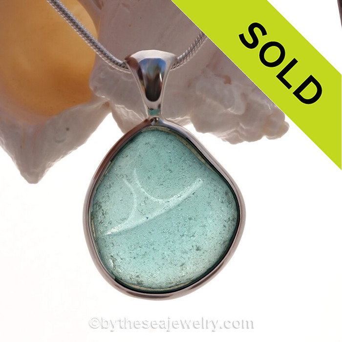 Elegant Embossed Large Aqua Blue Genuine Sea Glass in our In Our Deluxe Sterling Wire Bezel© Necklace Pendant.