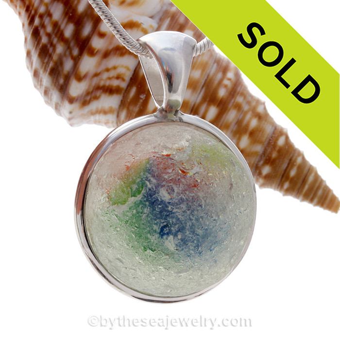 WOW is all you can say when you see the JUMBO Fiesta/Christmas beach found sea glass marble in a deluxe bezel By The Sea Jewelry piece.