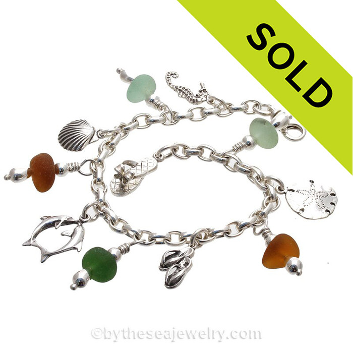 5 pieces of Genuine beach found Sea Glass on a totally Solid Sterling Silver Charm Bracelet.
The bracelet is made of top quality SOLID STERLING seamless Oval Rolo 4 MM links and has FULLY Soldered Utility Links for a lifetime of surety! The bracelet is secured with a and an oval Lobster Claw Clasp.