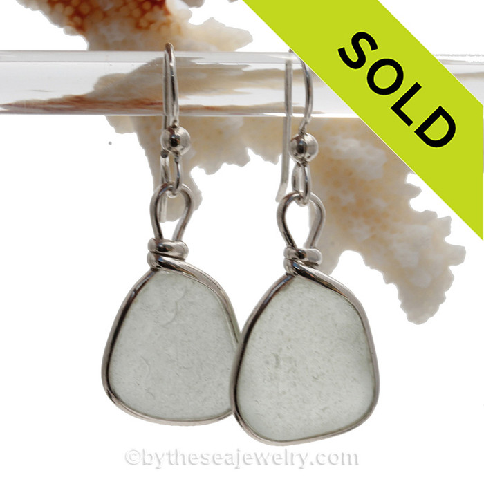 Perfect pieces of white beach found sea glass set in a lovely pair of genuine sea glass earrings in sterling. Our Original Wire Bezel© lets all the beauty of the sea glass shine without altering the glass in any way!