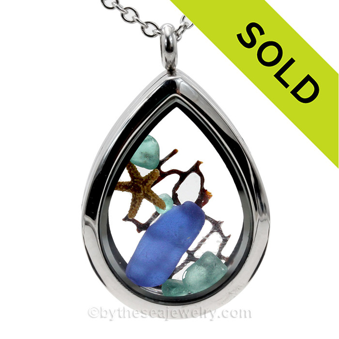 Beautiful  piece of genuine aqua and blue sea glass  a real starfish, a bit of vintage sea fan, in this water drop shaped solid Stainless Steel Magnetic Locket. . A FREE 24 Inch chain is included but Sterling options are available.