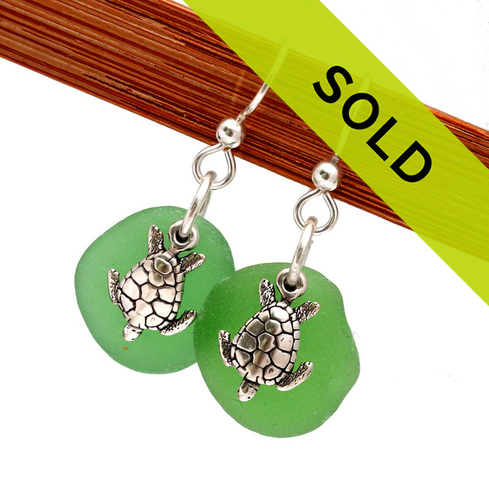 These green genuine sea glass earrings in sterling with sea turtles have been sold!