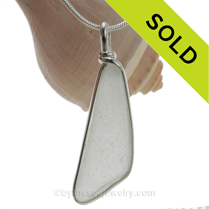 Pure white angular sea glass pendant in our sterling silver Original Wire Bezel© setting. This setting securely encases the sea glass without altering or damaging it!