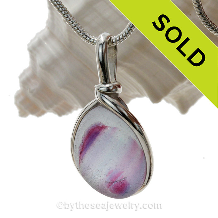 A nice piece of Ultra Rare Purple, Pink and Blue Sea Glass in our Original Wire Bezel© Sterling setting.