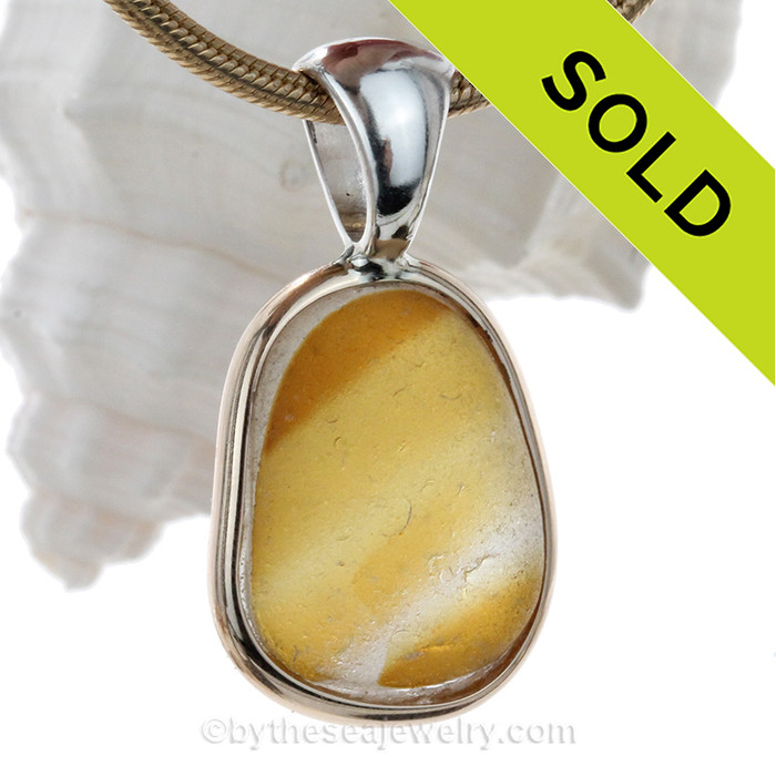 A lovely Warm Golden Yellow color mixed in white reminiscent of warm Summers. This Genuine Seaham Multie set in our Tiffany Deluxe Wire Bezel© in Solid Sterling Silver.