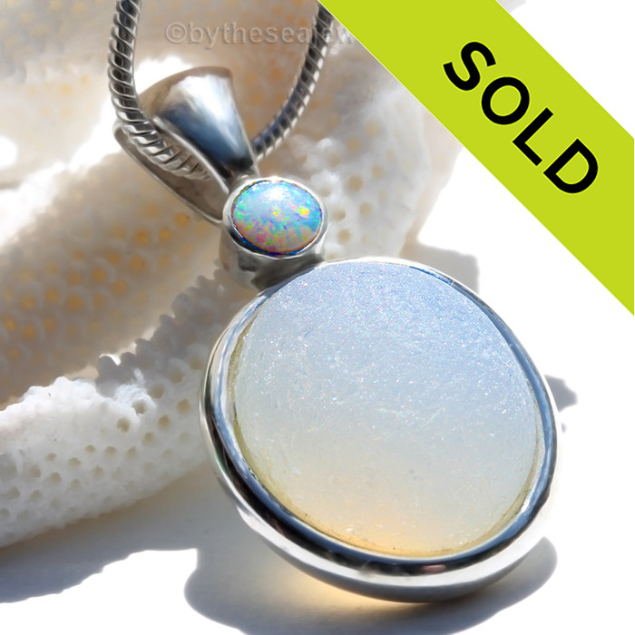 This beautiful HIGHLY RARE Opalized Seaham sea glass piece is set in our Deluxe Wire Bezel© pendant setting. This incorporates a Genuine Opal set in a bezel setting for a touch of elegance.