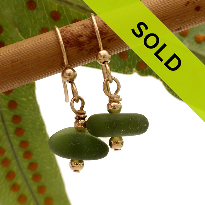 Very round and frosty pieces of genuine beach found jungle green sea glass in a simple drop gold earrings