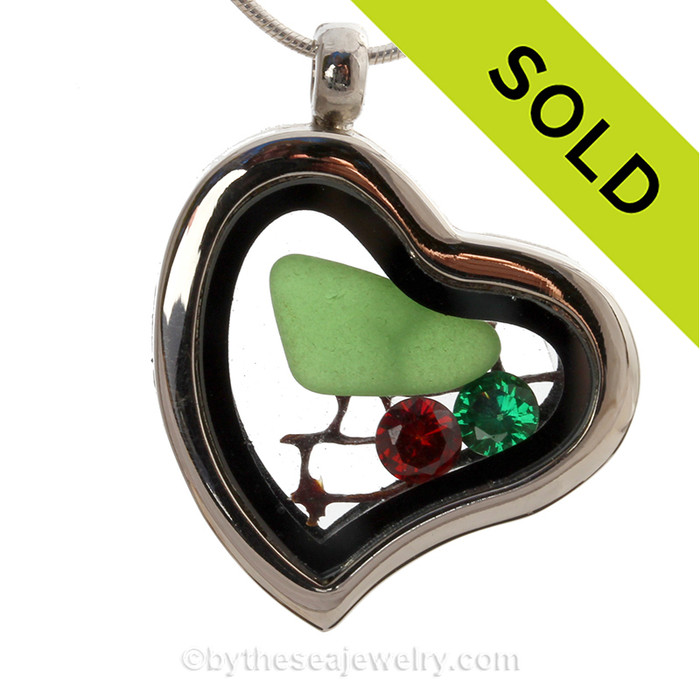 Our heart lockets make this Green Genuine Sea glass really shine! Free Floating and changing like the tide, this piece includes genuine top quality CZ Gems (the ice) and a small piece of vintage sea fan.