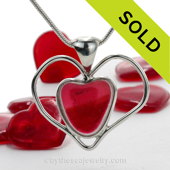 A beautiful and SUPER ULTRA RARE mixed pink and deep cranberry Hartley & Wood natural sea glass heart set in our deluxe wire bezel pendant setting with circling heart