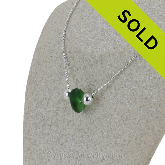 A lovely single sea glass drop in vivid green and finished with all solid sterling silver.