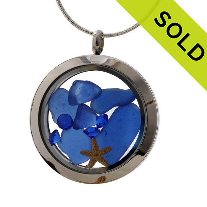 A beautiful pieces of natural blue Sea Glass Locket, stainless steel,with a real starfish.
