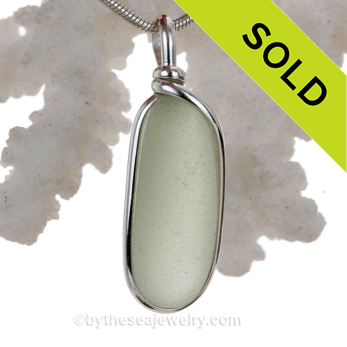 This is a beautiful Pale Peridot Green Sea Glass set in our Original Wire Bezel© pendant setting in Sterling Silver.
