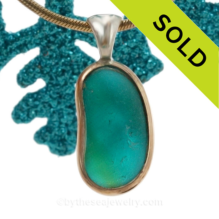 This amazing multi sea glass piece is versatile in a mixed metal Deluxe Wire Bezel© pendant setting.