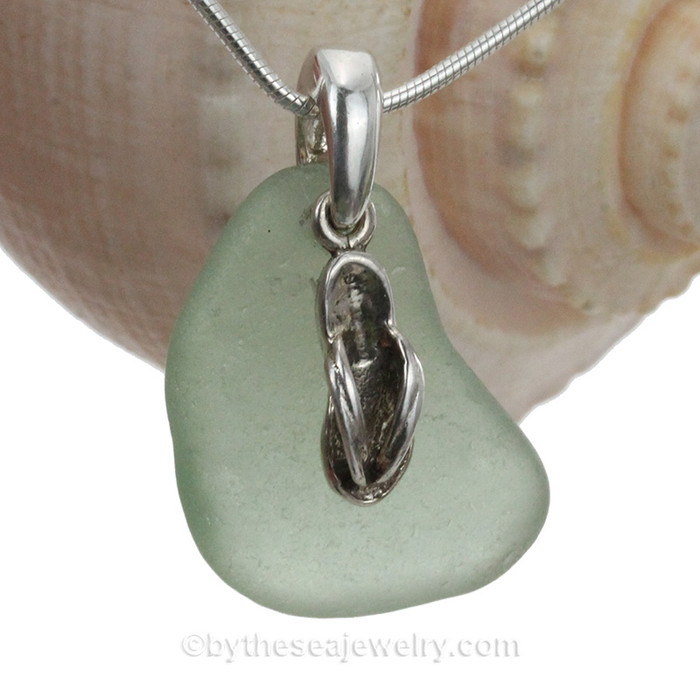 A simple genuine seafoam green sea glass necklace with beachy details.